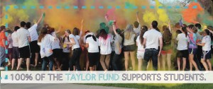 Front of Taylor Fund mailer, with picture of students throwing colored powder. Text reads, "100% of the Taylor Fund supports students."